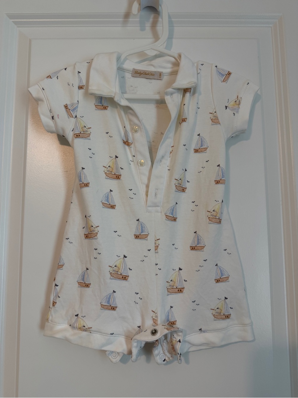 Baby Club Chic Polo Romper with Blue and Tan Accents